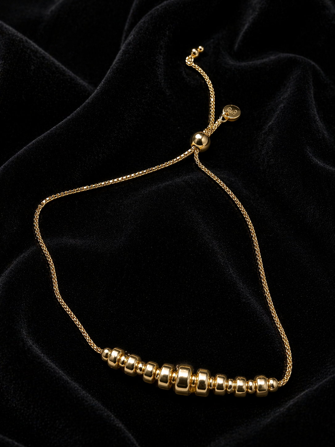 14KYG POL CNTR GRAD BEADS ON BOLO