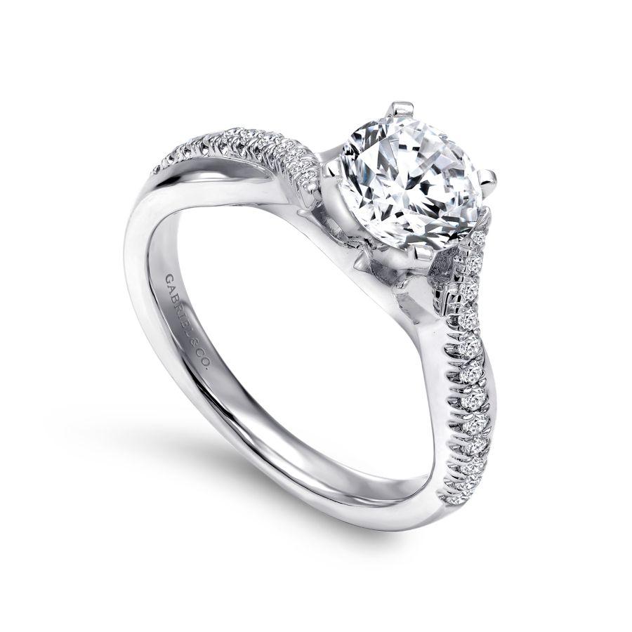 14kw .19ct Dia Semi-Mount    Designed for the bold woman  this exceptional engagement ring includes a diamond and precious metal criss cross setting that meets at the center for a flair of sophistication.