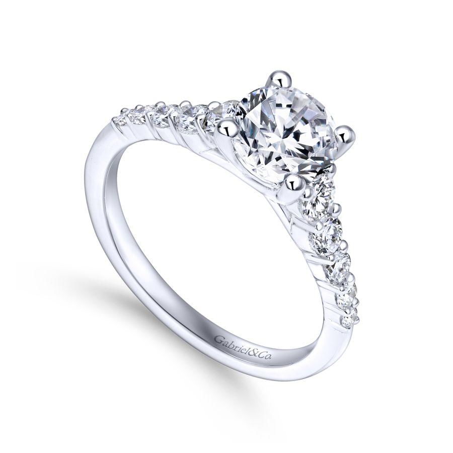 14kw .48ct Dia Semi-Mount    Astonishing 0.48ct accent diamonds in shared prong settings line the reverse tapered shank of this sophisticated engagement ring designed for a 1ct round center stone. The graduated diamonds create a look that is mode